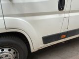 an image of a white van parked on the side of the road