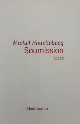 a close up of a book with a red and white cover