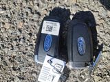 two remotes that are laying on the ground next to each other