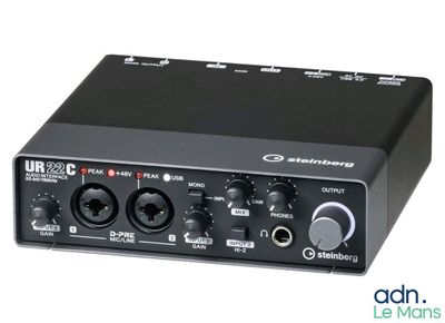 a close up of a black audio interface on a white background