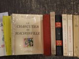 many books that are sitting on a table together