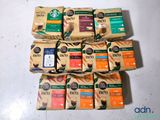 a pile of coffee bags sitting on a table
