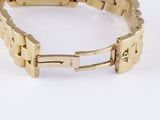 an image of a close up of a gold bracelet on a white surface