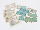 many different types of paper money on the table