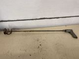 a metal object on the floor next to a white wall
