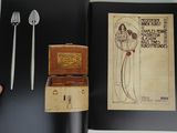 a picture of a book with a picture of a woman holding a knife and fork