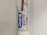 a tube of toothpaste sitting on a counter