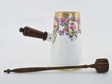 an image of a tea pot with a wooden handle