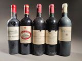six bottles of wine are lined up in a row on a table