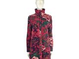 the mannequin is wearing a red and black dress with pink flowers