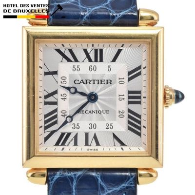 a close up of a watch with roman numerals on the face