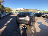 cars parked in a parking lot in front of a building