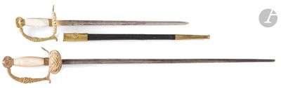 three different types of swords are displayed on a white surface