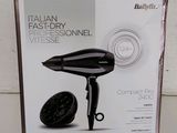 the box of a hair dryer is open on the table