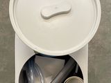 an overhead view of a trash can with a lid and a hose