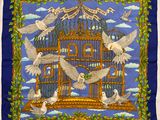 une écharpe bleue avec l'image d'un oiseau en cage