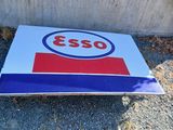 a close up of a sign on the ground near a building