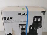 packaging of a black and white coffee maker sitting on top of a table
