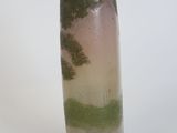 a vase that is sitting on a white surface