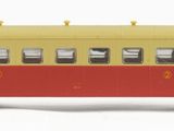 a red and yellow train car on a white background