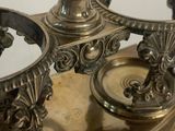a close up of a silver plate with a clock on it