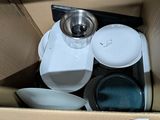 a box full of dishes and bowls in it