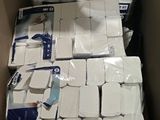 boxes of toilet paper stacked on top of each other in a cardboard box