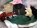 a basket full of clothes that is sitting on a table