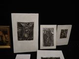 several framed pictures of a woman and a man on a black background
