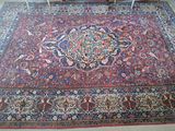 a large oriental rug on the floor in a living room