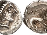 a silver coin with an image of a man and a woman on it