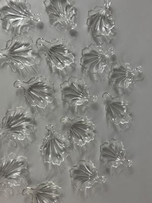 a lot of glass flowers that are on the table
