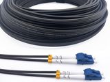 a close up of three black and white cables on a white surface
