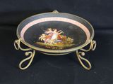 an image of a plate with a painting on it on a stand