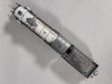 a silver and black model of a train on a white surface