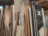 several pieces of wood are stacked on top of each other in a room