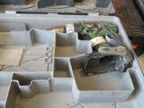 a tool box with tools in it sitting on the floor