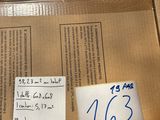 a cardboard box with a lot of papers on it