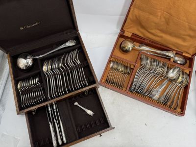 a lot of silverware in a box on a table
