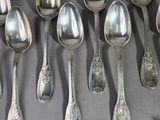 a lot of spoons and forks on the table
