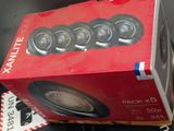 a box of speakers sitting on a table next to a keyboard