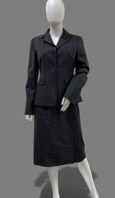 an image of a mannequin wearing a suit and skirt
