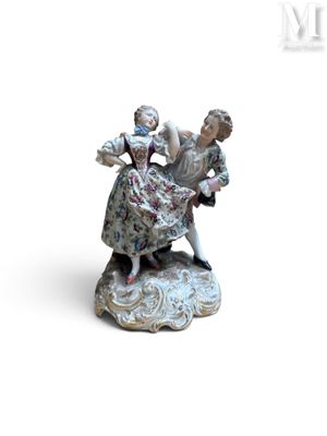 a figurine of a woman and a child on a rock