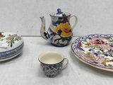 a table with a plate, cup, and saucer on it