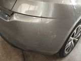 a close up of a car that has been painted silver