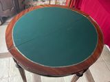 a small table that has a green top on it