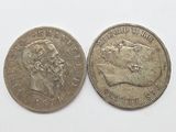 two old british coins, one silver and one silver, on a white surface