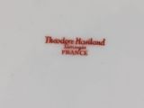 a white plate with a red inscription on it