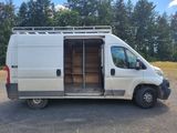 an image of a white van parked in a parking lot