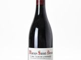 a bottle of wine that is sitting on a table